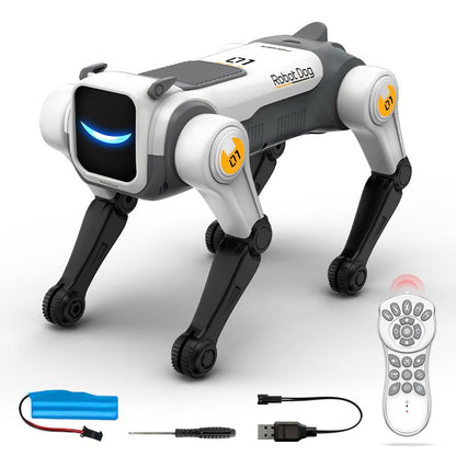 Chien robot télécommandé avec sa télécommande, sa batterie rechargeable, son câble USB et un tournevis